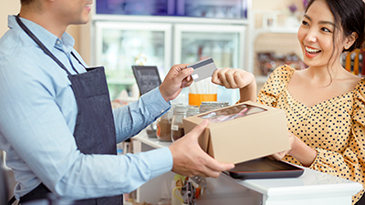 Cashier accepts payment from a customer